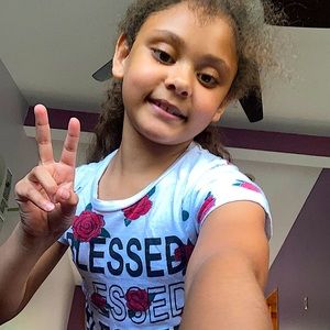 A rose T-shirt that says blessed